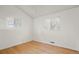 Spacious bedroom with hardwood floors and ample natural light at 1575 S Clermont St, Denver, CO 80222