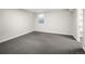 Spacious basement bedroom with carpet and an adjacent closet at 1575 S Clermont St, Denver, CO 80222