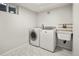 Convenient laundry room with washer, dryer, and utility sink at 1575 S Clermont St, Denver, CO 80222
