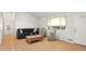 Living room featuring hardwood floors, ample natural light, and comfortable seating at 1575 S Clermont St, Denver, CO 80222