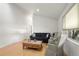Bright living room with hardwood floors, comfy seating, and large windows at 1575 S Clermont St, Denver, CO 80222