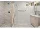 Basement bathroom with shower, vanity, and updated finishes at 1575 S Clermont St, Denver, CO 80222
