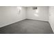 Bright and airy basement bedroom with carpet flooring and a window at 1575 S Clermont St, Denver, CO 80222