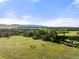 Aerial view of property showing expansive land and distant mountains at 3675 S Perry Park Rd, Sedalia, CO 80135