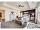 Elegant primary bedroom with plush bedding and a calming color scheme at 7899 S Country Club Pkwy, Aurora, CO 80016