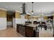 Spacious kitchen with an island, stainless steel appliances, and granite countertops at 28525 Pike View Farm Cir, Elizabeth, CO 80107