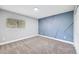 Well-lit secondary bedroom with neutral walls and carpeted floors at 14602 E 2Nd Ave # 206C, Aurora, CO 80011