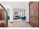 Bright entryway with hardwood floors and a view into the living room at 15079 Prairie Pl, Broomfield, CO 80023