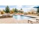 Relaxing pool area with a spa and lounge chairs at 15079 Prairie Pl, Broomfield, CO 80023