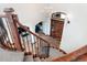 View from above of a grand curved staircase with wrought iron railing at 15079 Prairie Pl, Broomfield, CO 80023