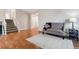 Living room with hardwood floors and a cozy seating area at 4227 S Andes Way, Aurora, CO 80013