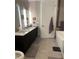 Modern bathroom with double vanity and large soaking tub at 4200 W 17Th Ave # 215, Denver, CO 80204