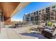 Large patio with seating area and city views at 4200 W 17Th Ave # 215, Denver, CO 80204