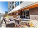 Spacious patio with comfortable seating and a large patterned rug at 4200 W 17Th Ave # 215, Denver, CO 80204