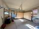 Finished garage with overhead storage and built-in cabinets at 9581 Firenze Way, Highlands Ranch, CO 80126