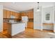 Kitchen with island and light wood cabinets at 179 N Prairie Falcon Pkwy, Brighton, CO 80601