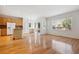 Open concept kitchen with island and hardwood floors at 179 N Prairie Falcon Pkwy, Brighton, CO 80601