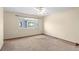 Bright bedroom with a large window and ceiling fan at 8971 W Yale Ave, Lakewood, CO 80227