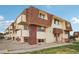 Apartment building exterior with landscaping and walkway at 10211 Ura Ln # 8-207, Thornton, CO 80260