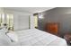 Spacious bedroom with a large bed and access to bathroom at 10211 Ura Ln # 8-207, Thornton, CO 80260