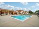 Community pool with adjacent patio area at 10211 Ura Ln # 8-207, Thornton, CO 80260