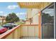 Private balcony with view of the complex pool and surrounding buildings at 10211 Ura Ln # 8-207, Thornton, CO 80260