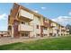 Apartment building exterior showcasing its brick and wood siding at 10211 Ura Ln # 8-207, Thornton, CO 80260