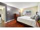 Bedroom with double bed, dresser, and view at 10211 Ura Ln # 8-207, Thornton, CO 80260