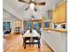 Dining area with hardwood floors and kitchen access at 3540 E Arapahoe Pl, Centennial, CO 80122