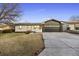 Ranch-style home with modern updates and a landscaped yard at 870 S Eaton St, Lakewood, CO 80226