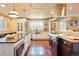 Spacious kitchen featuring granite countertops, stainless steel appliances, and hardwood floors at 5410 Columbine Rd, Denver, CO 80221