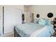 Spacious bedroom with a large closet and light blue bedding at 875 E 78Th Ave # 40, Denver, CO 80229