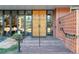 Building entrance with ornate doors and brick steps at 4570 E Yale Ave # 702, Denver, CO 80222