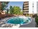 Refreshing community pool with surrounding lounge chairs at 4570 E Yale Ave # 702, Denver, CO 80222