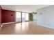 Bright living room with hardwood floors and balcony access at 4570 E Yale Ave # 702, Denver, CO 80222