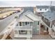 Aerial view of a two-story house with a gray exterior, balcony, and a small yard at , Denver, CO 80249