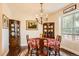 Elegant dining room with hardwood floors, chandelier, and built-in hutch at 6885 W 68Th Ave, Arvada, CO 80003