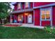 Inviting front porch with teal chairs and a small table at 6885 W 68Th Ave, Arvada, CO 80003