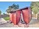 Red storage shed in the backyard provides additional storage space at 7050 Alan Dr, Denver, CO 80221