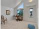 Bright bedroom with large windows, carpeted floor, and built-in desk at 114 E 14Th Ct, Broomfield, CO 80020