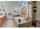 Spacious bathroom with soaking tub, double vanity, and walk-in shower at 114 E 14Th Ct, Broomfield, CO 80020