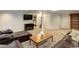 Spacious basement Gathering room featuring comfortable seating and a large TV at 114 E 14Th Ct, Broomfield, CO 80020