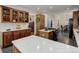 Kitchen boasts expansive countertops, wooden cabinetry, and an open layout at 114 E 14Th Ct, Broomfield, CO 80020