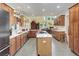 Modern kitchen with island, stainless steel appliances, and ample cabinet space at 114 E 14Th Ct, Broomfield, CO 80020