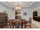 Elegant dining room featuring a large table and kitchen views at 114 E 14Th Ct, Broomfield, CO 80020