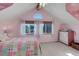 Charming bedroom with vaulted ceiling, window seat, and dresser at 114 E 14Th Ct, Broomfield, CO 80020