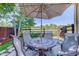 Relaxing patio with seating area and umbrella, perfect for outdoor dining at 114 E 14Th Ct, Broomfield, CO 80020