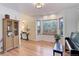 Light-filled living room with hardwood floors and built-in shelving at 114 E 14Th Ct, Broomfield, CO 80020