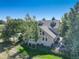 Luxury home with landscaped yard, spacious patio, and mature trees at 114 E 14Th Ct, Broomfield, CO 80020