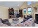 Living room with fireplace, built-in shelving and large windows at 114 E 14Th Ct, Broomfield, CO 80020